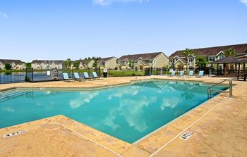 Refreshing Outdoor Swimming Pool with Lounge Area